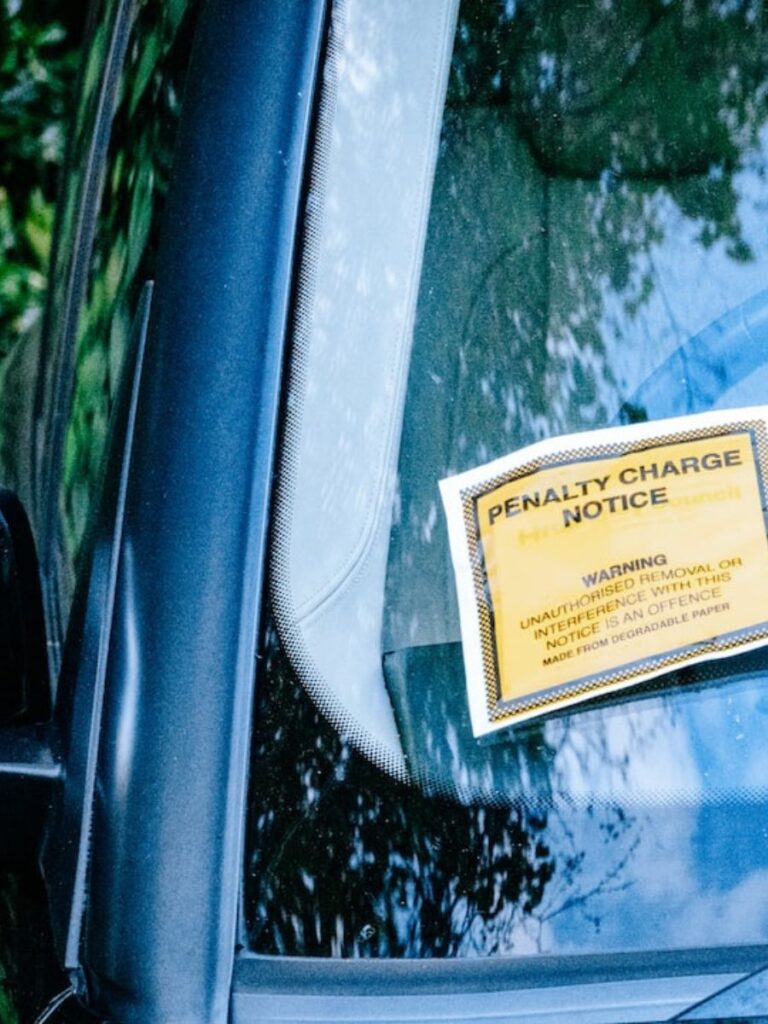 notice of penalty left on a car windshield