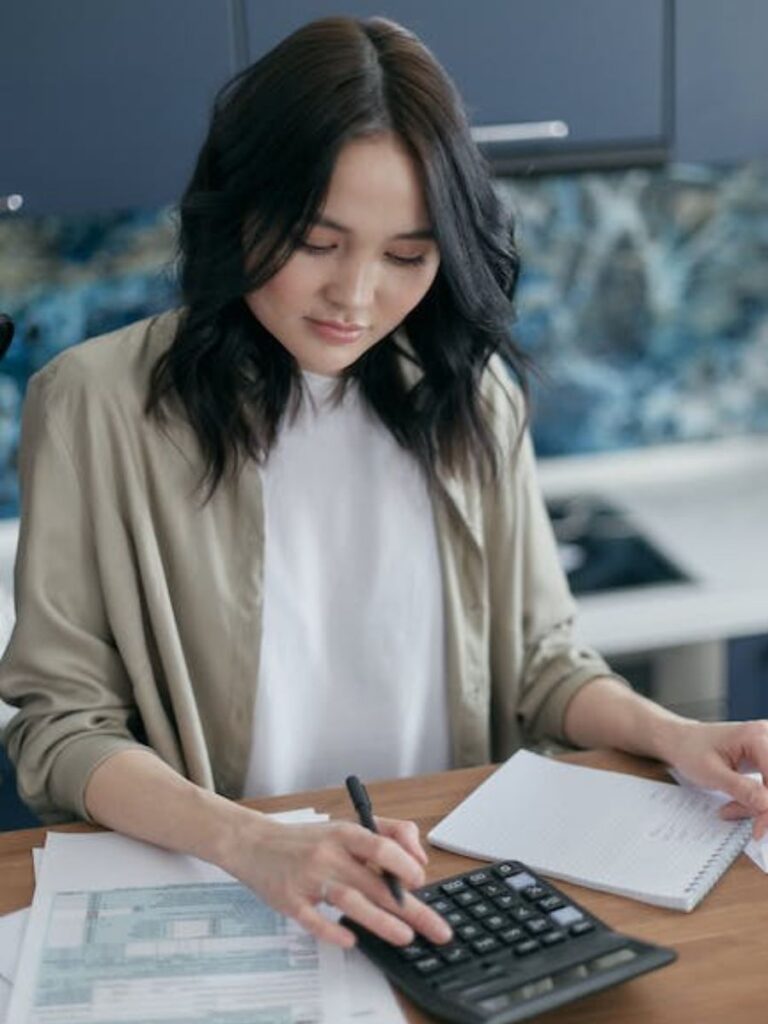 woman calculating her taxes