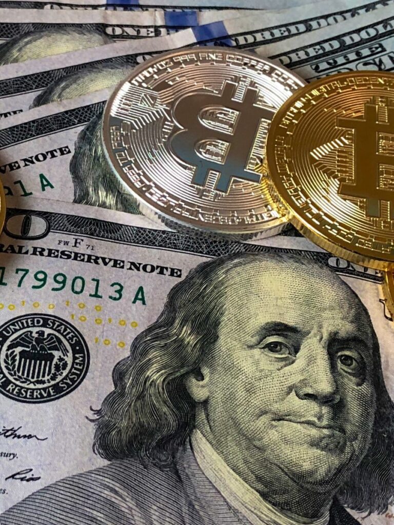 dollar bills mixing with bitcoin