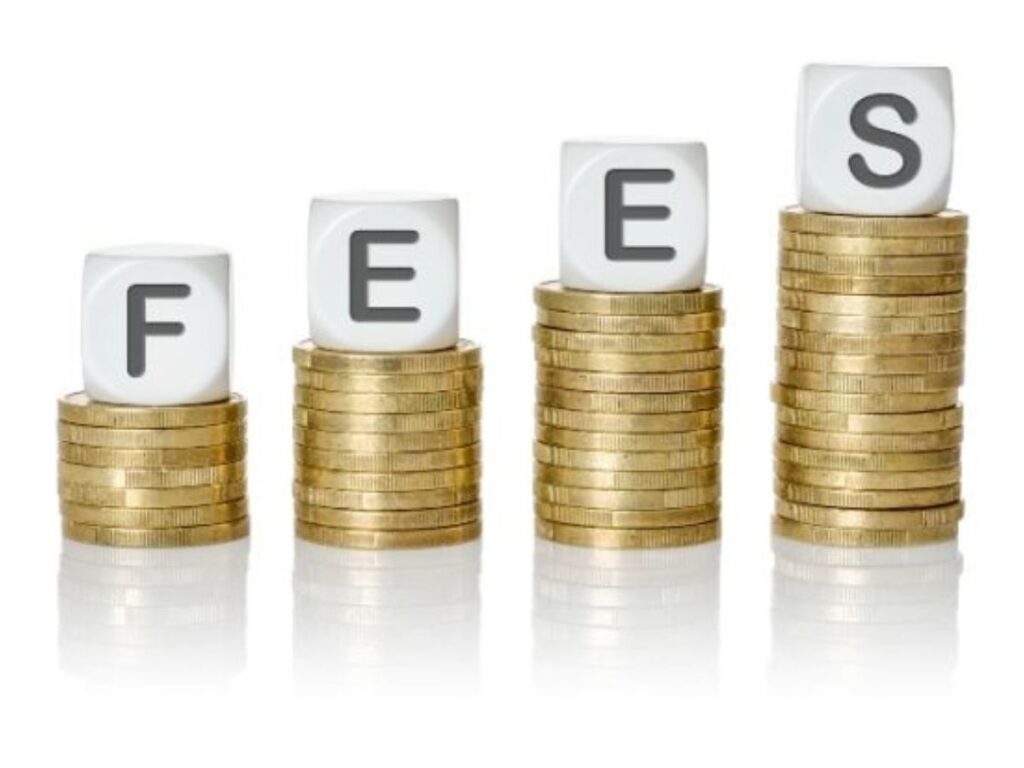 A succession of piles of gold coins with white dies on top that spell out the word “Fees”