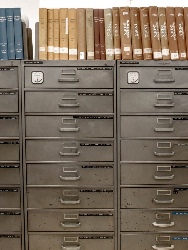 filing cabinets with organized books and records on top