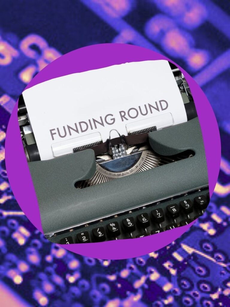 a typewriter with a piece of paper sticking out that says “Funding Round” on a purple background