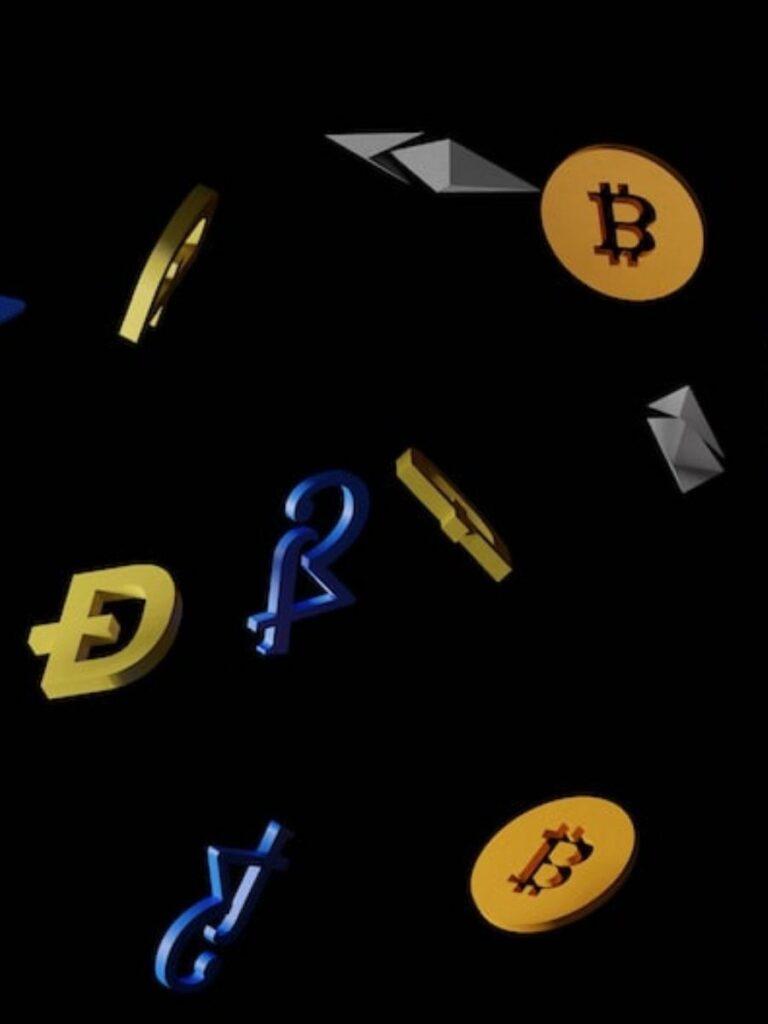 a scattering of crypto symbols on a black background as if tossed in the air